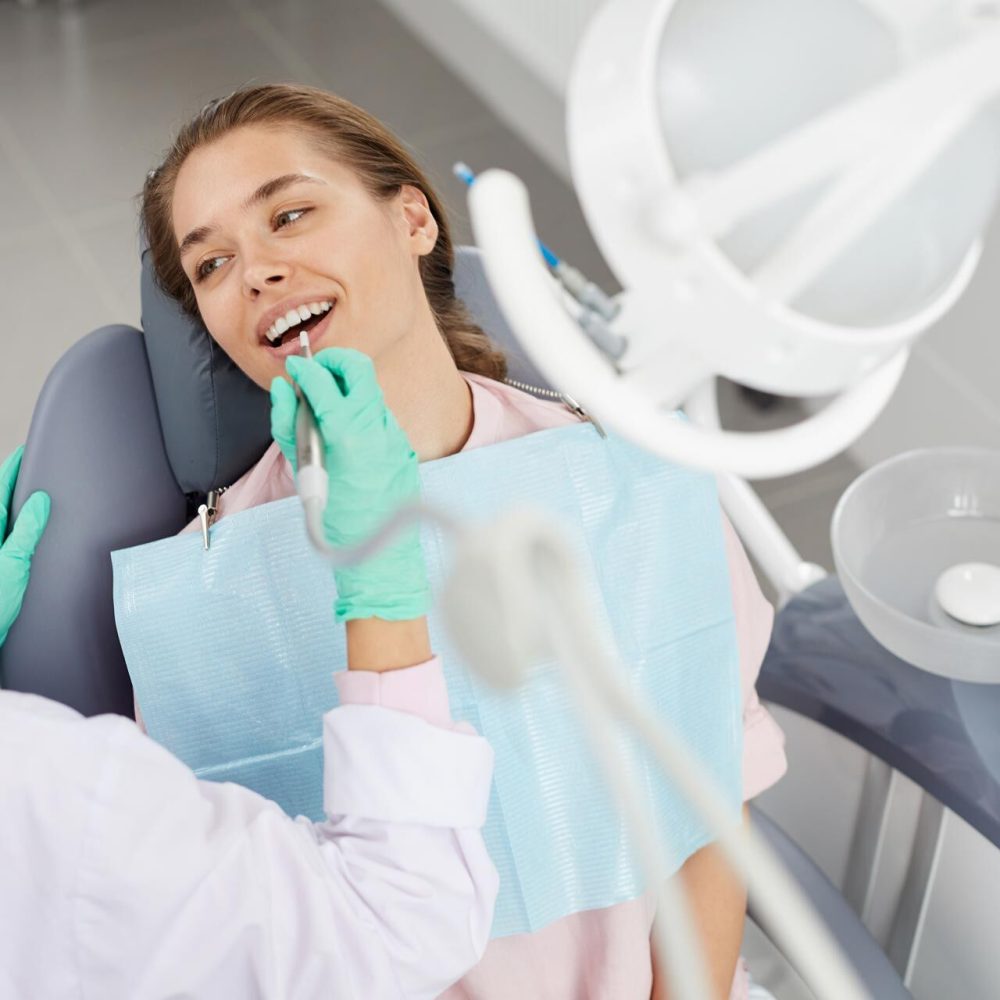 young-woman-at-dental-exam-3XD85GH.jpg